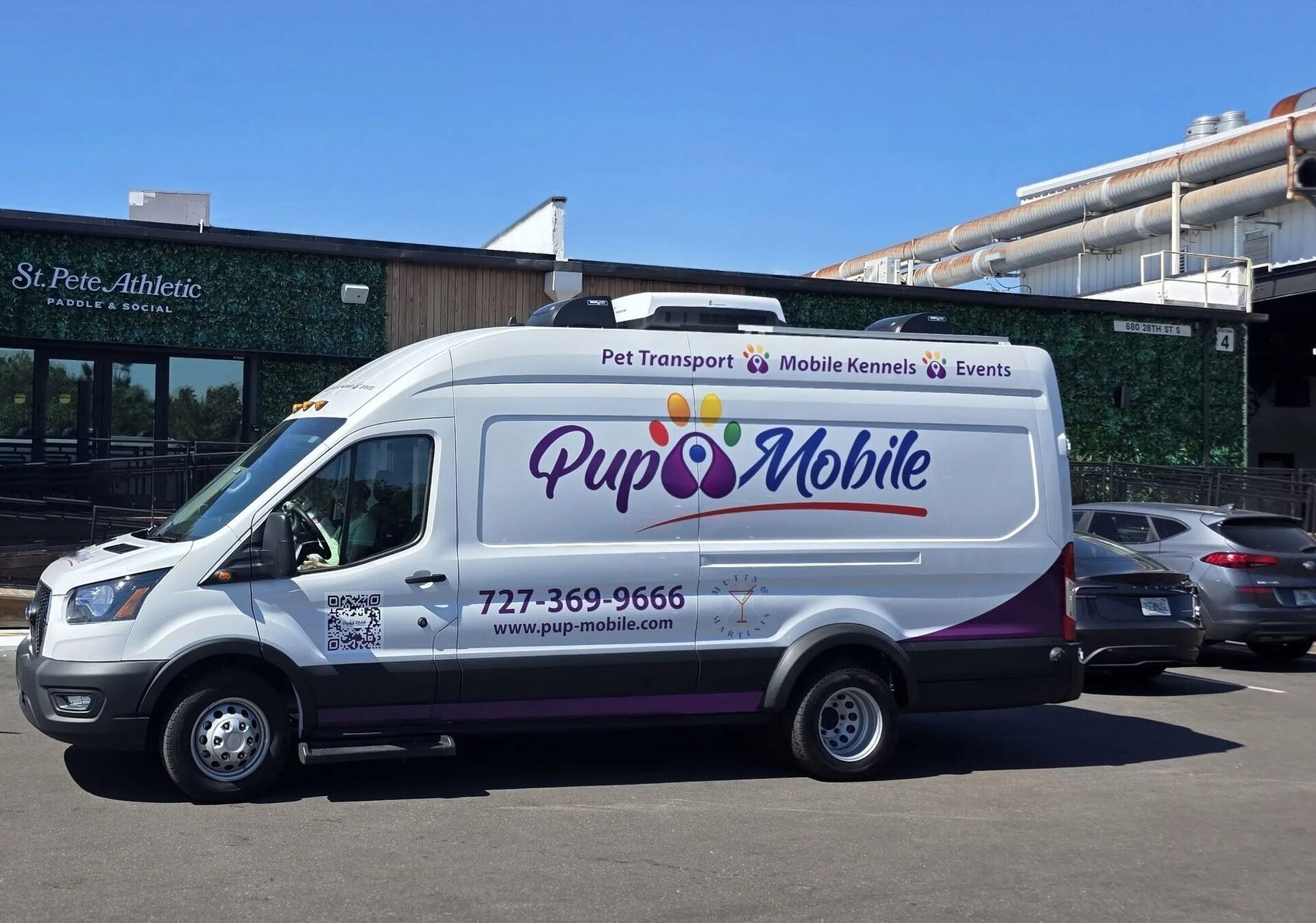The Pup Mobile van parked at St. Pete Athletic
